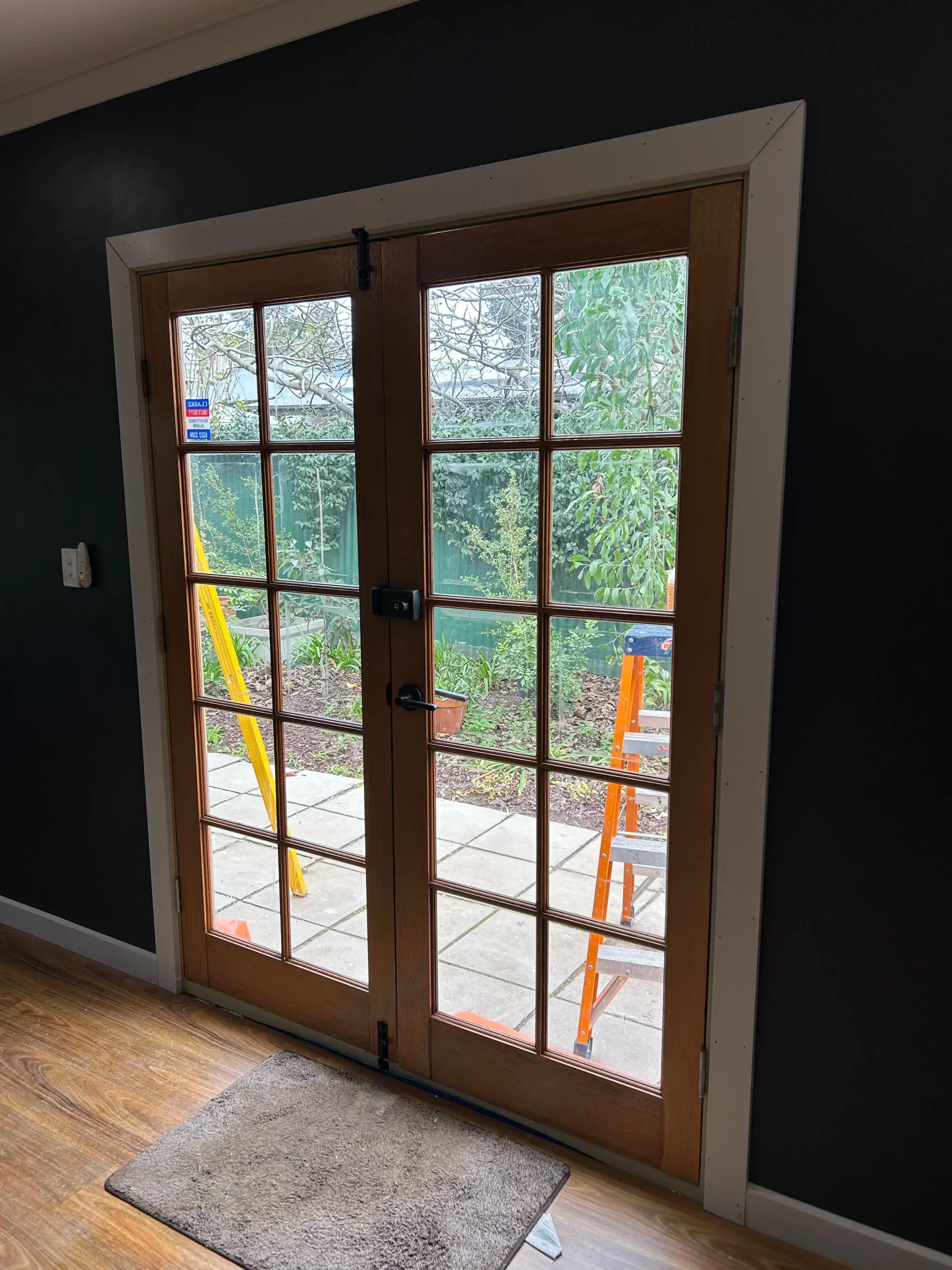 New timber French doors opening onto the garden in a Bella Carpentry conversion in Adelaide